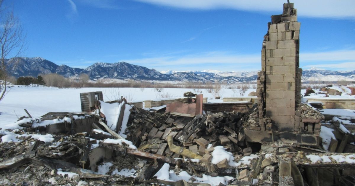Crumbled structure destroyed by Marshall Fire in Colorado.