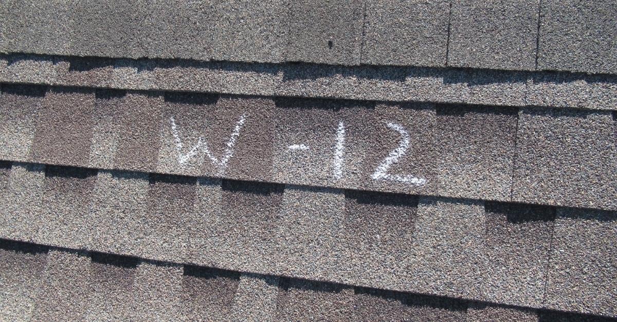 Asphalt shingle roof with hail damage