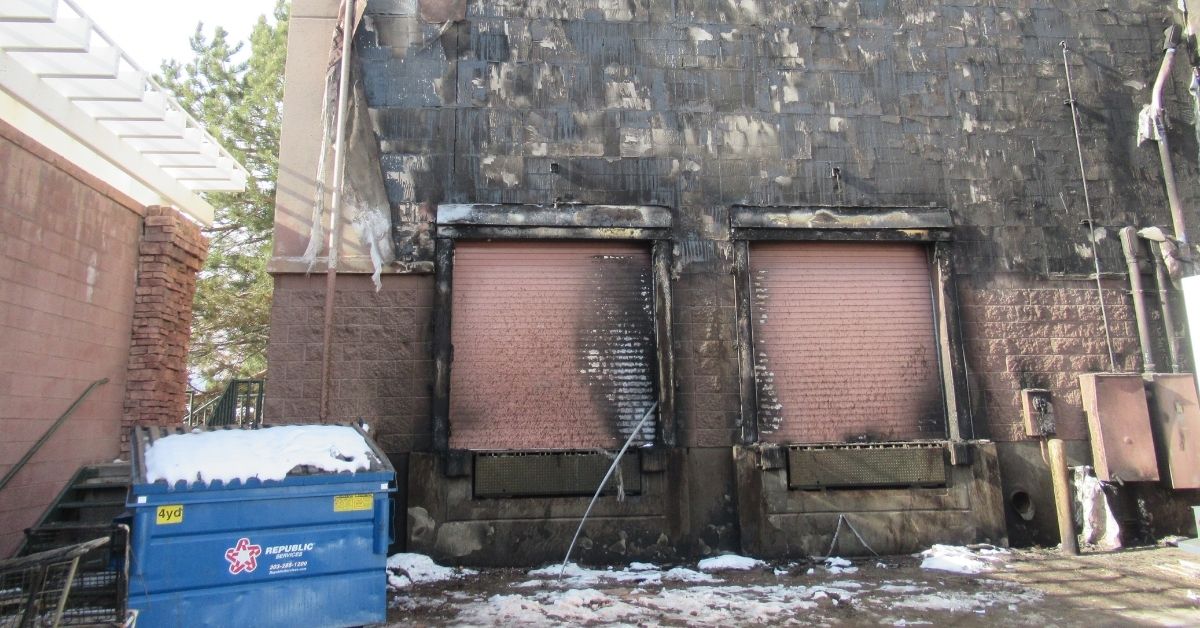 Charred exterior walls in a loading dock area burned during the Marshall Fire in Colorado.